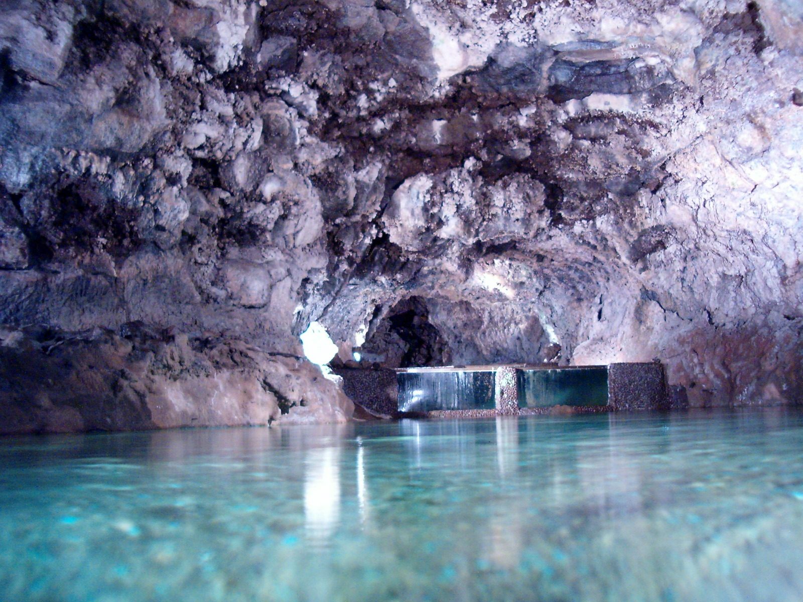 Lit lava tube passage inside the São Vicente caves
