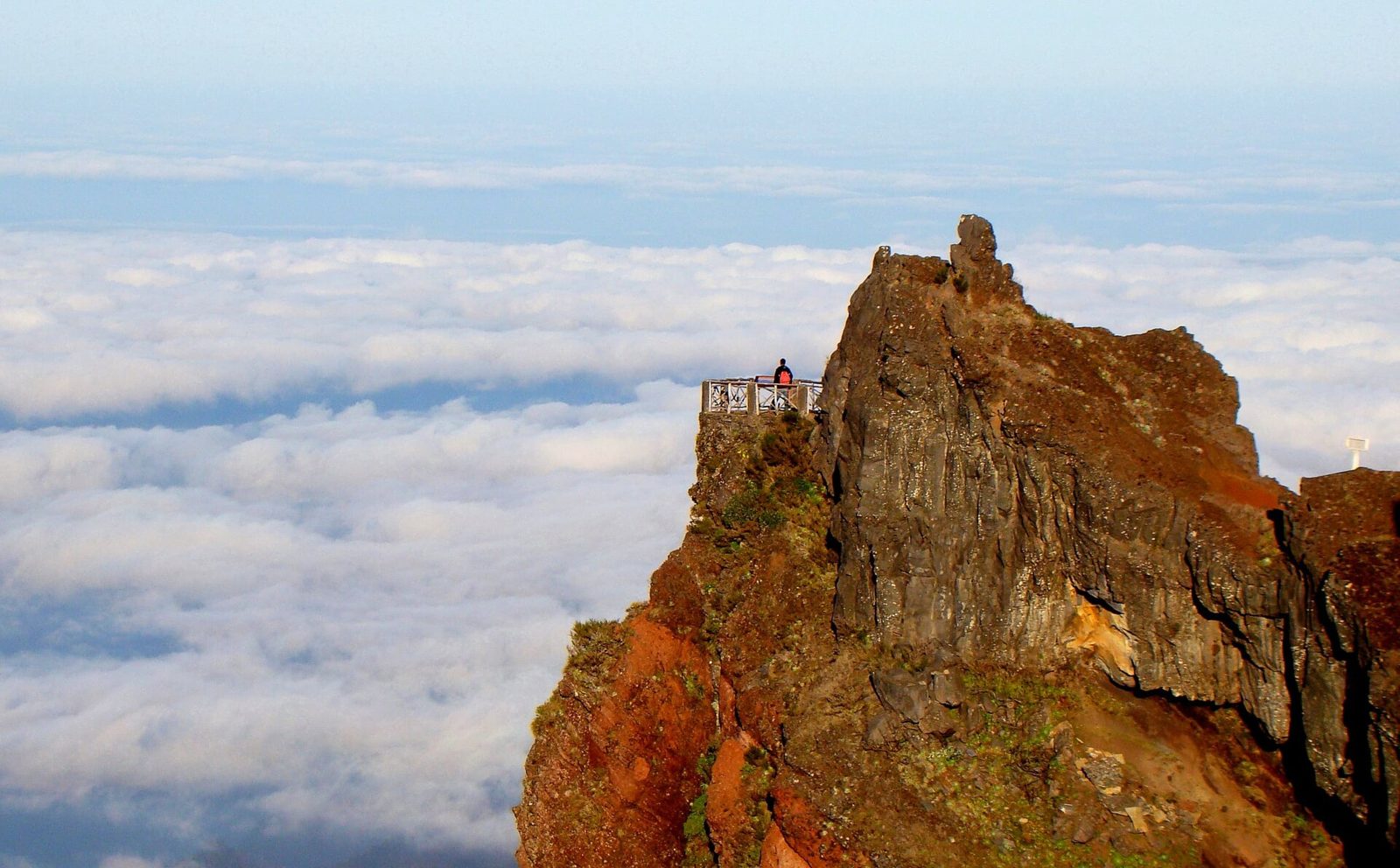 Railed viewpoint balcony on a knife-edge ridge in Madeira's central mountains