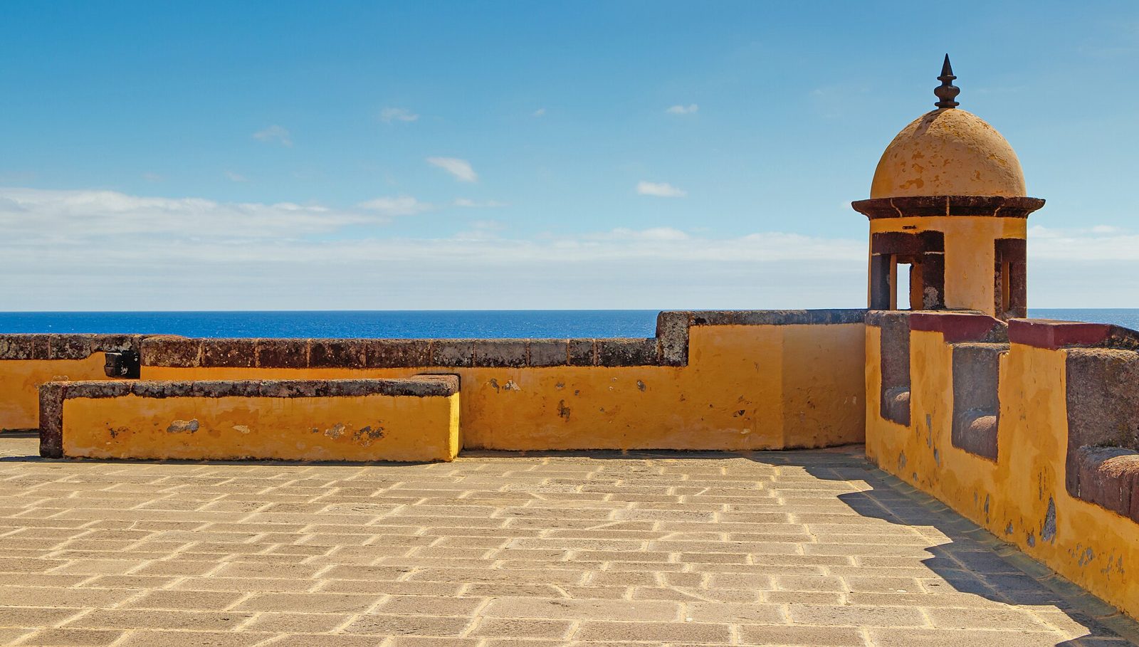 Ochre walls of the Fortaleza de São Tiago above the sea in Funchal