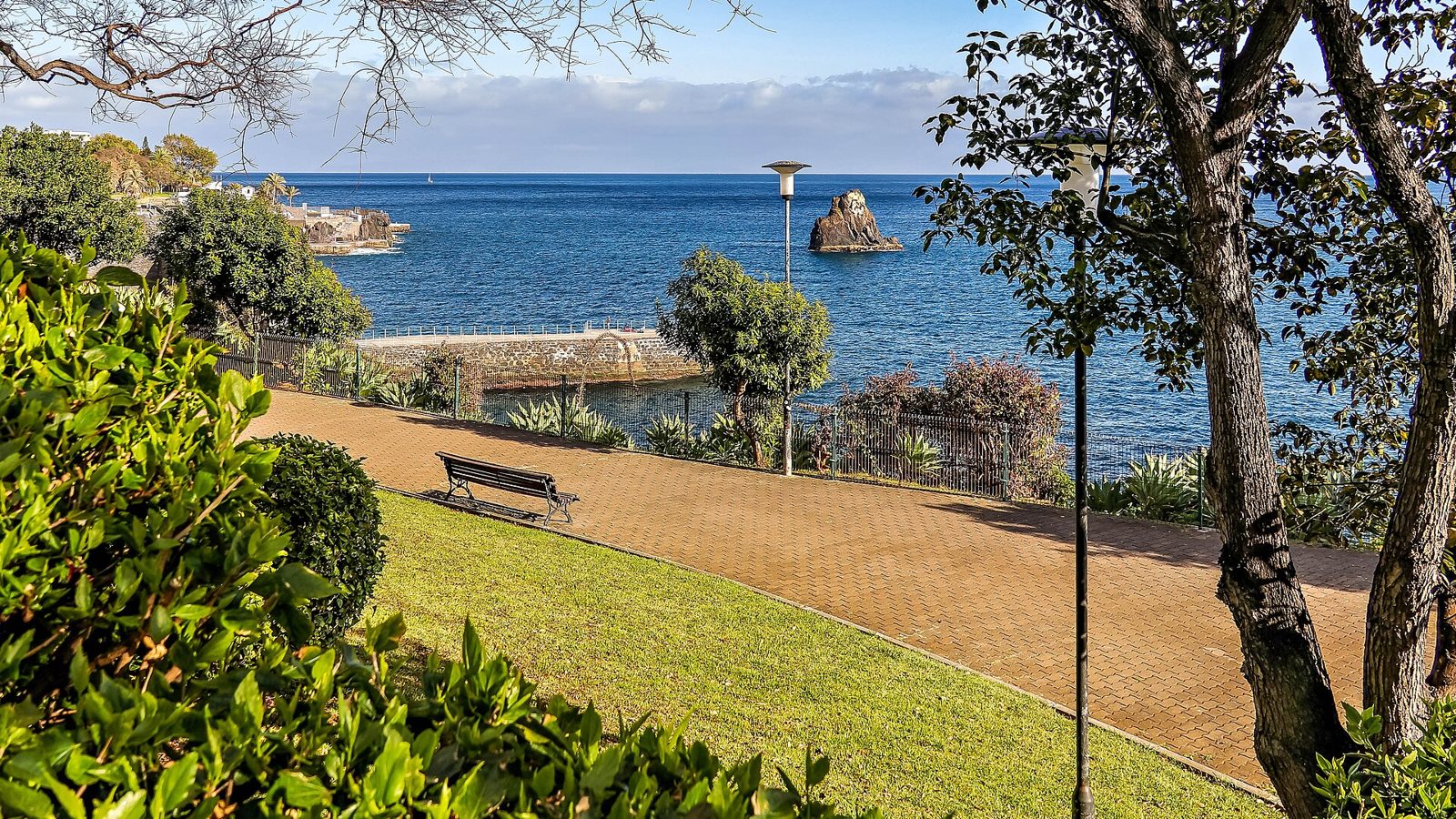 Seafront promenade running along the rocky coast at Funchal's Lido