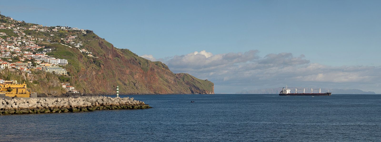 Christ the King statue standing on a headland above the sea at Garajau