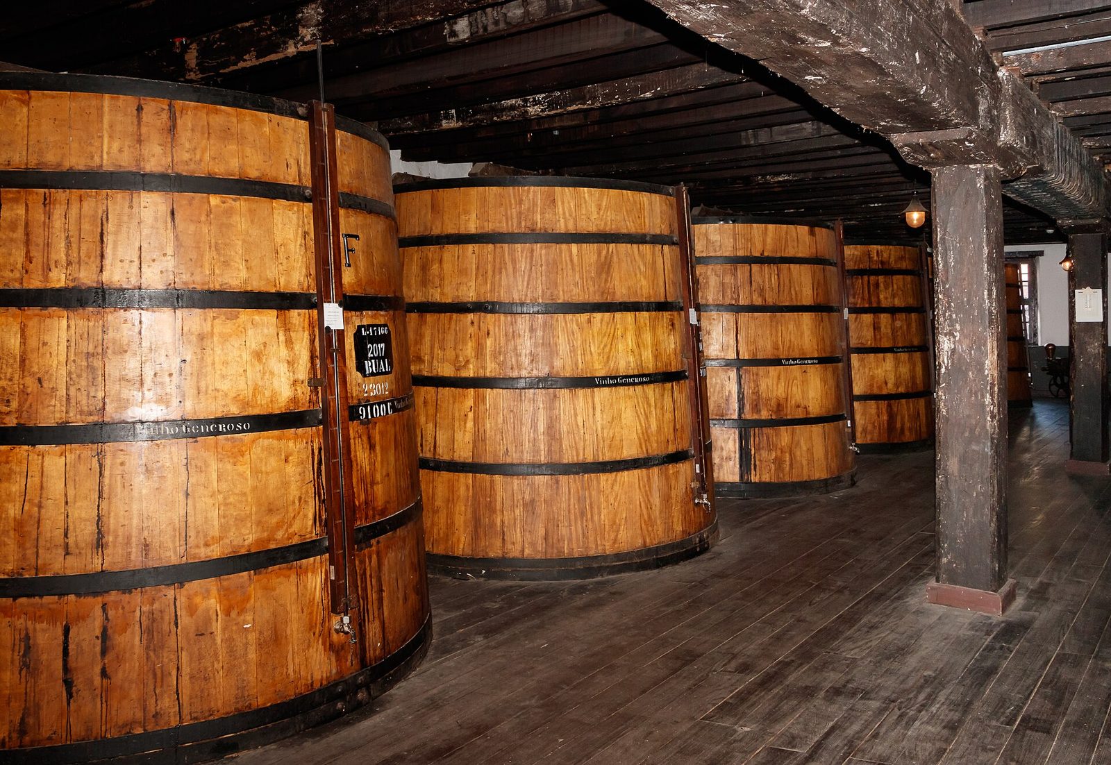 Old wooden casks of Madeira wine in the Blandy's lodge in Funchal