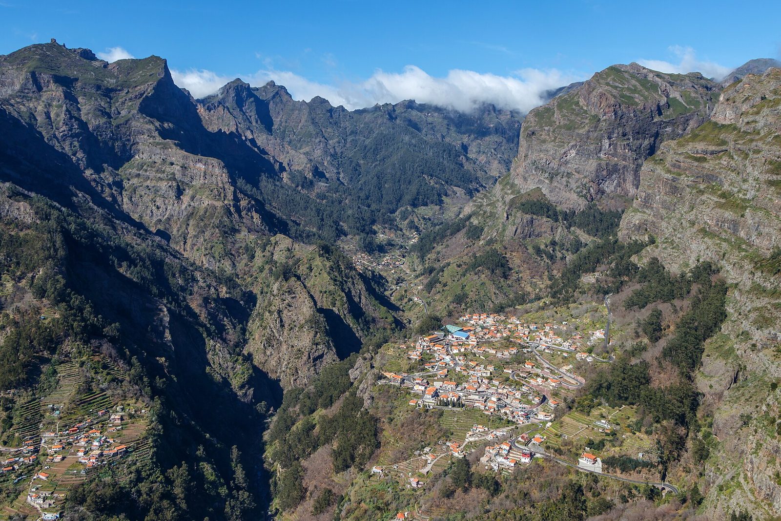 View down into the deep green valley of Curral das Freiras from Eira do Serrado